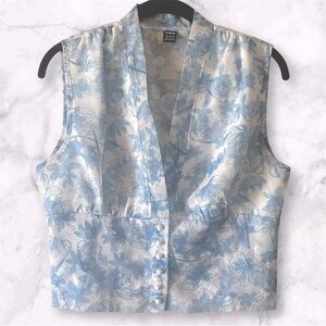 Blue and white floral blouse with button-up front and pearl buttons